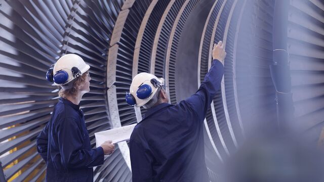Engineers Looking At Turbine SMALL